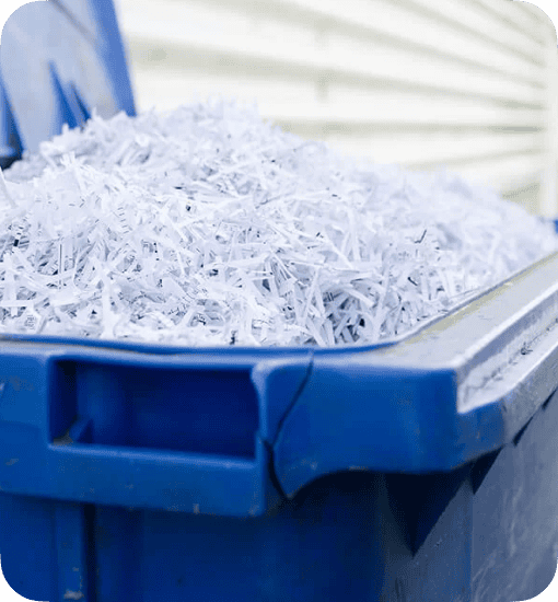a blue wheelie bin full of shredded paper
