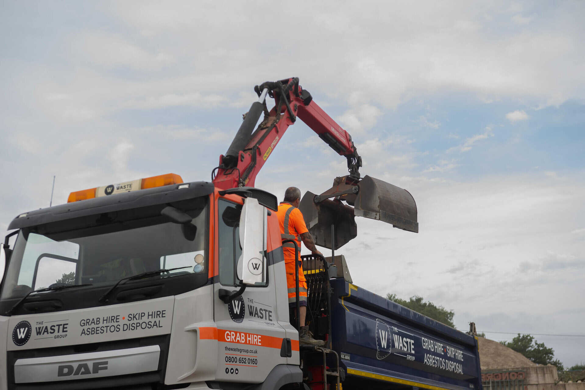 Grab lorry hire Dorset — The Waste Group driver and grab lorry ready for collection