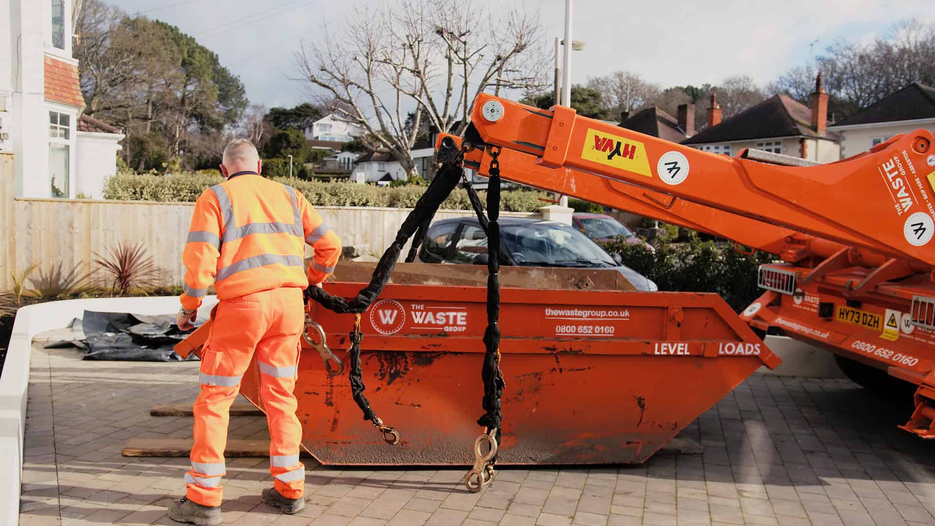 Skip hire Reading — Waste Group orange skip delivered across BH21